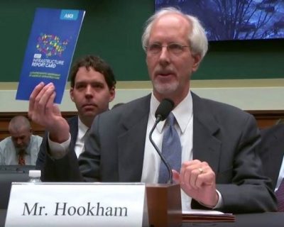 Mr. Hookham discussing infrastructure report card at a hearing